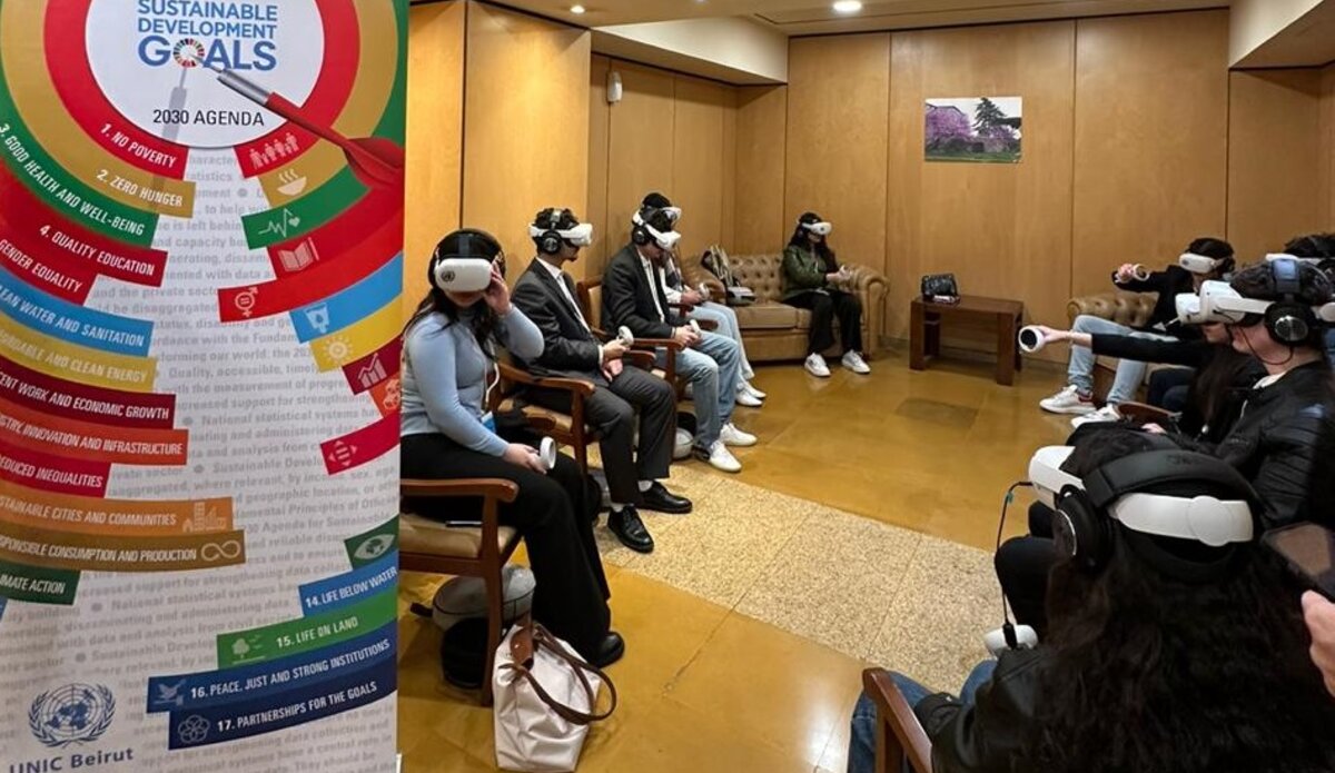 Students watching the VR documentary using headsets and controllers.